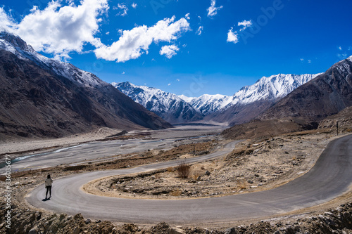 Landscape view during a road trip with snow mountains on the background On the way to Pangong lake in Ladakh, Jammu and Kashmir, North India © ting_149