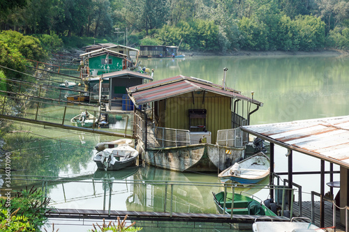 Canvas Print houseboat parked by the river near the swamp