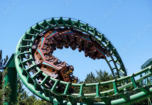 Rollercoaster track against a brilliant blue sky