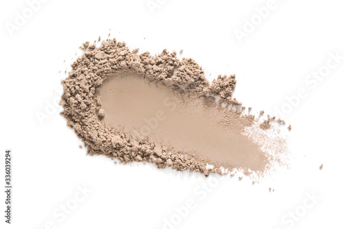 Face makeup powder texture. Beige eye shadow swatch smudge isolated on white. Light brown nude make up product sample closeup