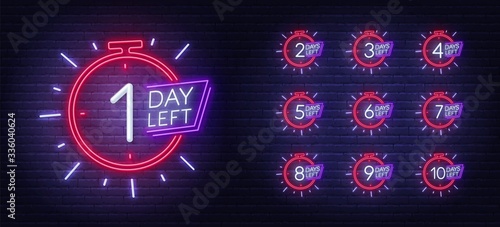 Neon sign countdown days to event on brick wall background. Number of days left. photo