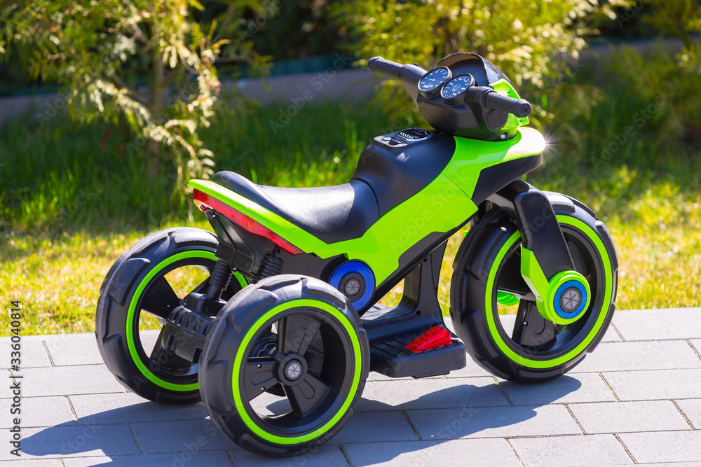 An electric motorcycle for kids in the garden