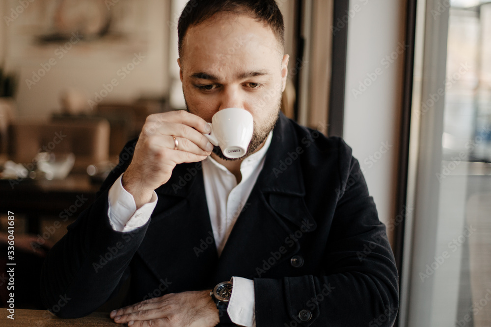 Portrait of fashionable well dressed man with beard posing outdoors Portrait of fashionable well dressed man with beard posing outdoors