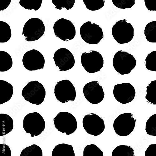 Vector illustration of a seamless black dotted with rounded spots with grunge effect isolated on white background. Stock illustration. Can print on paper or fabric.