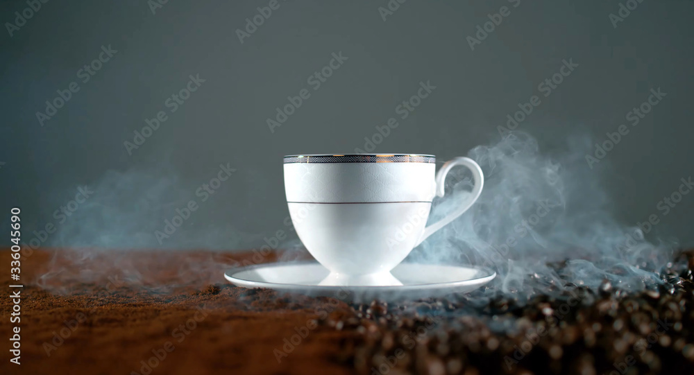 white cup of coffee on the table. Coffee beans, ground coffee.
white cup of coffee on the table. Coffee beans, ground coffee.