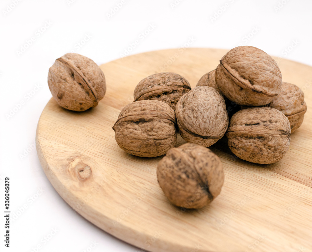 fresh walnuts, superfood, healthy foods, nuts on a wooden surface, close-up fresh walnuts, superfood, healthy foods, nuts on a wooden surface, close-up