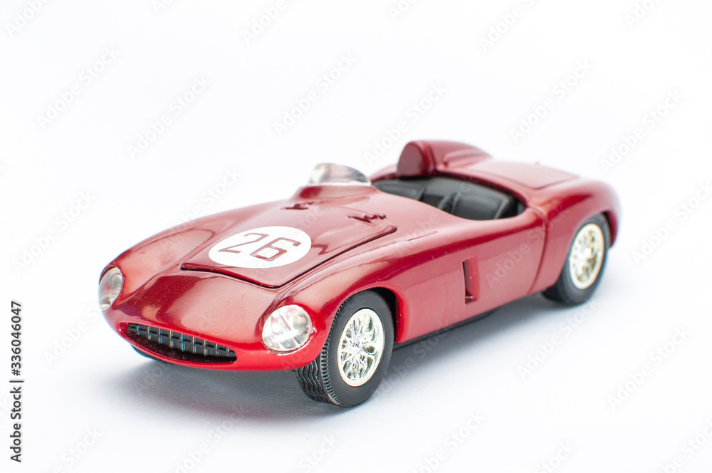 Red toy car on white background