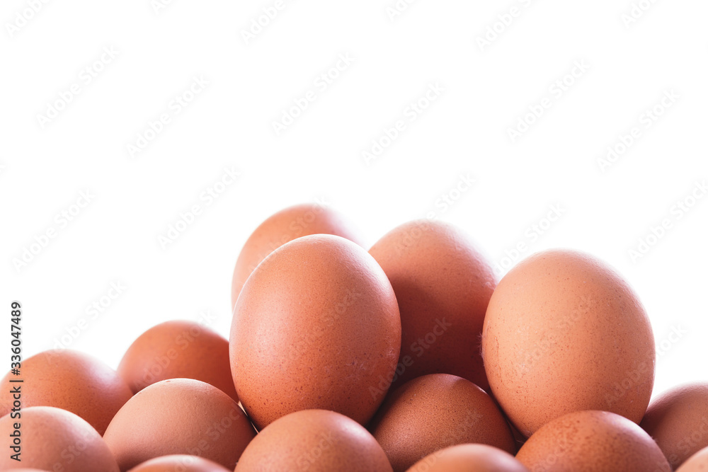 Pile of Fresh eggs, closeup on white background Pile of Fresh eggs, closeup on white background