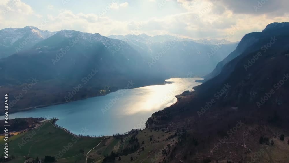 Amazing view of a lake with sun shining through the clouds. Aerial drone shot. Triglav National Park, Slovenia Amazing view of a lake with sun shining through the clouds. Aerial drone shot. Triglav National Park, Slovenia