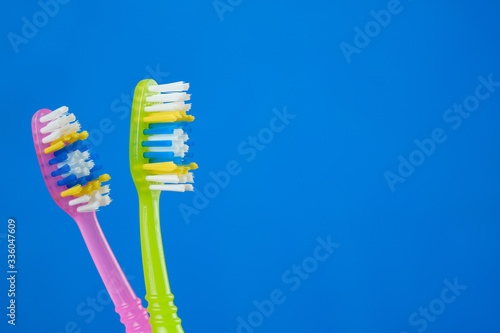 toothbrush green and pink on blue background  couple