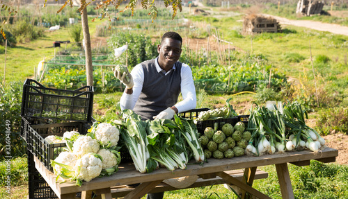 Photography Afro man selling organic agricultural products