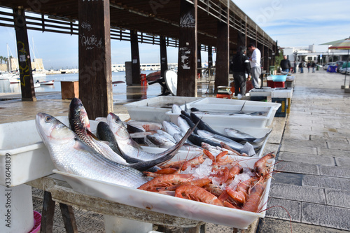 Fototapeta Naklejka Na Ścianę i Meble -  Trays with fresh seafood - fish and shrimps in ice - for sale on the fish-market of Bari, Italy