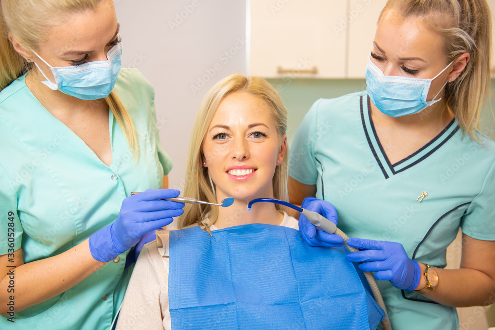 Female patient visiting dentist office, ready for dental procedures Female patient visiting dentist office, ready for dental procedures