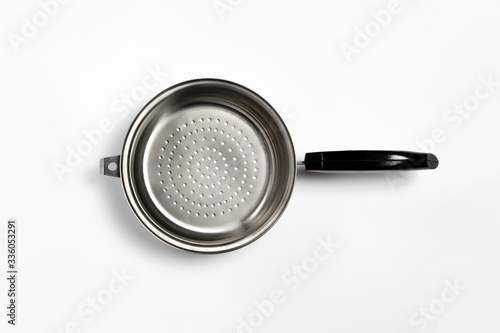 Stainless steel Colander on white background.Top view.High-resolution photo.