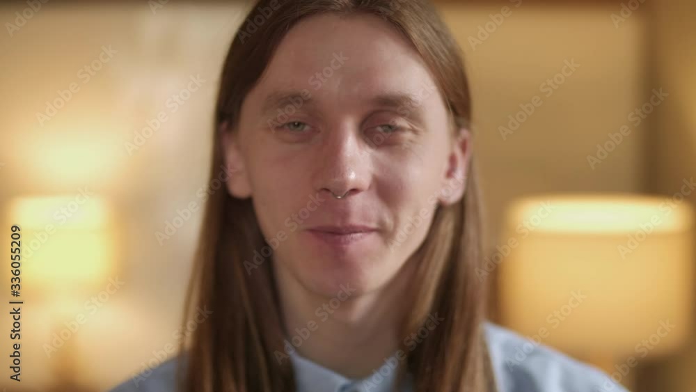 Close Up Of Happy Handsome Man Looking To Camera. People Portraits. Concept Of Emotions. Blurred Office Background. Close Up Of Happy Handsome Man Looking To Camera. People Portraits. Concept Of Emotions. Blurred Office Background.
