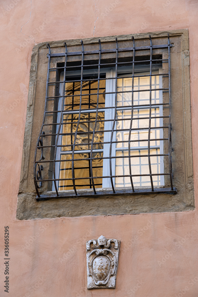 Arezzo, Tuscany: historic buildings. Duomo reflected in a window
