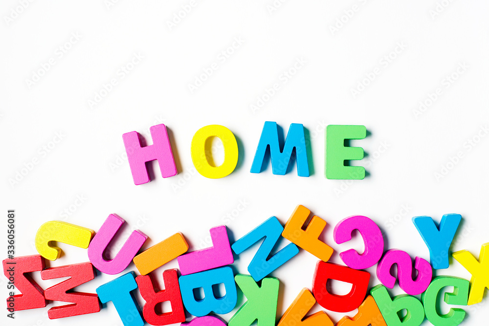 Obraz premium ' HOME ' Colorful Wooden Letters and Word, Stay Home, Social Distancing
