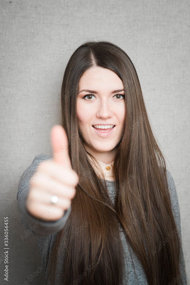 Success woman showing thumbs up Success woman showing thumbs up