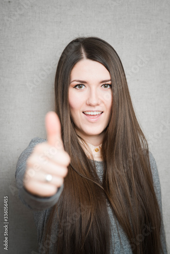 Success woman showing thumbs up