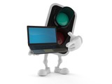Green traffic light character holding laptop