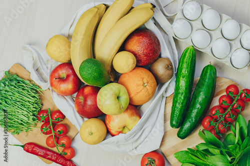 Colored fruits and vegetables on a white table. Juice and smoothie ingredients. Healthy eating, diet concept