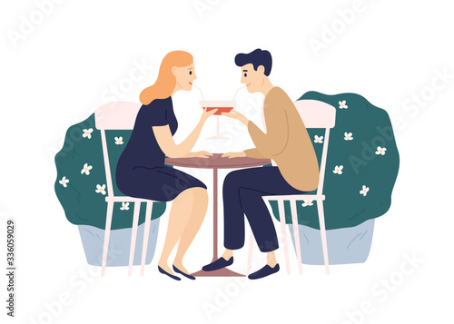 Happy couple drink beverage from one glass using straw sit at table isolated ...