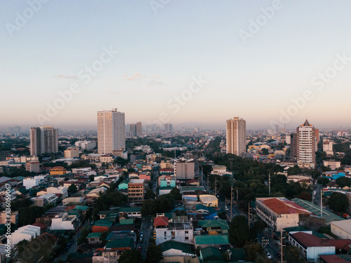 Aerial drone shot of a Residential Area in Quezon City in Metro Manila, Philippines while sunset