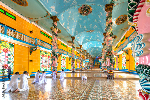 Photography People praying in holy Cao Dai monastery