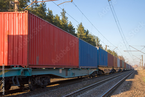 Cargo containers transportation on freight train by railway. Coronavirus Wreaks Havoc On Global Industry. Global economy is heading into a recession thanks to the widening fallout from the COVID-19 photo