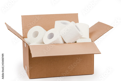 Toilet paper rolls in a cardboard box isolated on a white background