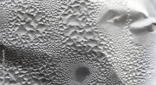 Water Drops On Foil Grey White Background, Texture colorful water drop. Abstract detail of moisture condensation problems, hot water vapor condensed on foil close up