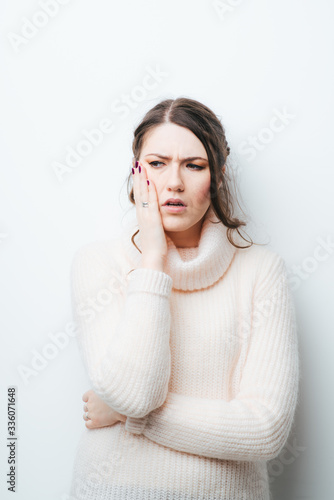 on a white background girl in a toothache