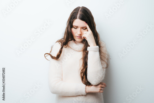 Fényképezés Half-length portrait of woman touching her head