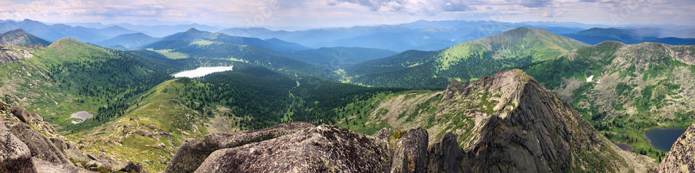 Expanse of the Sayan Mountains, Natural Park Ergaki. Siberian nature, traveling in Russia. Wide panoramic view.
