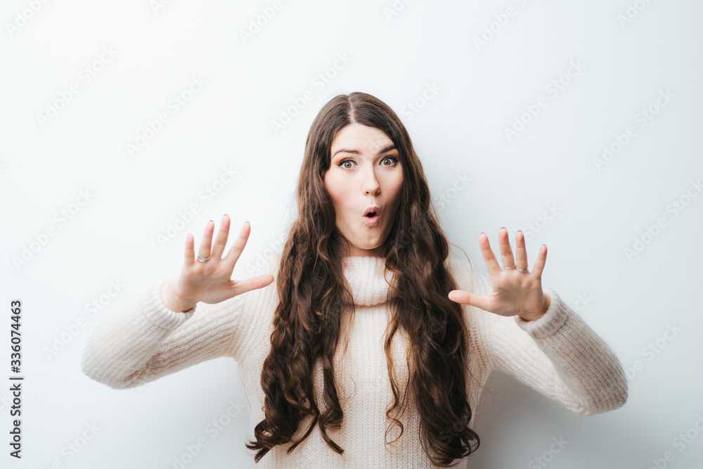 on a white background young girl with long hair says wait
