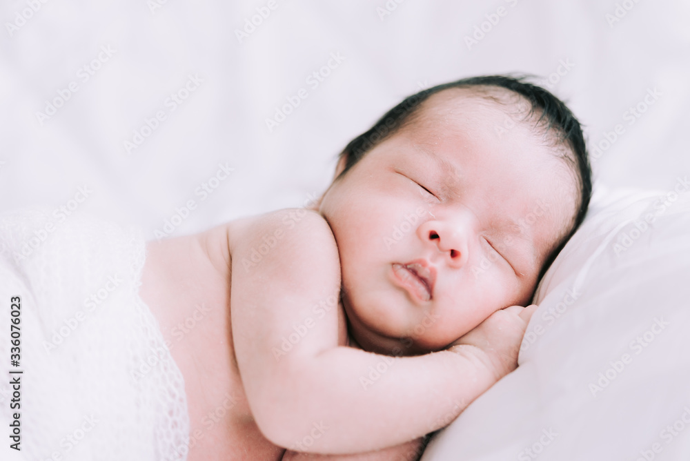 Smiling baby boy lying on a white bed, Family morning at home,Children hygiene. Smiling baby boy lying on a white bed, Family morning at home,Children hygiene.