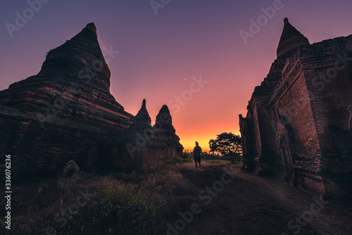 Visiting Bagan Myanmar Girl explores old stupas after sunset