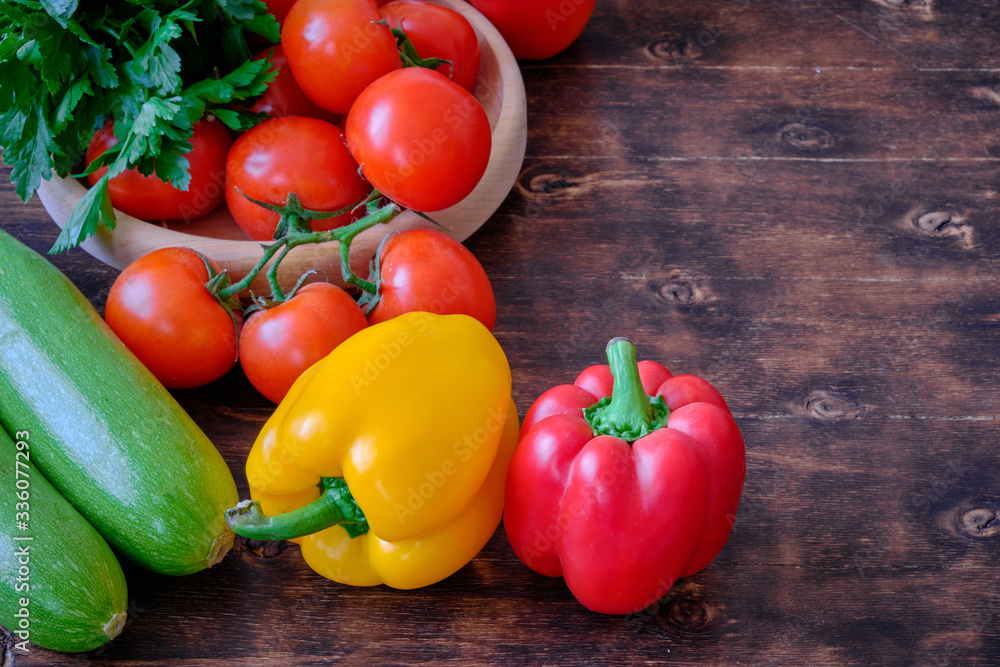 Healthy food. Vegetables and fruit. On a black wooden background. Top view. Space for copying.