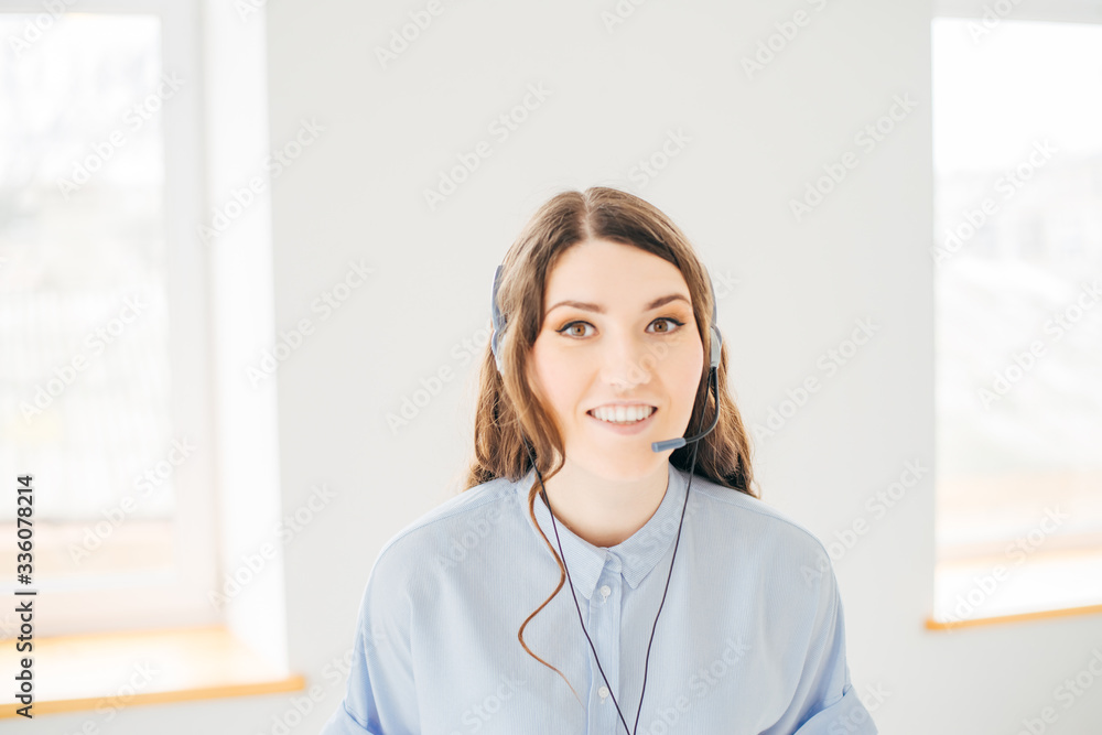 Close-up portrait of a customer service agent near the window Close-up portrait of a customer service agent near the window