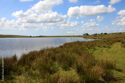 Bodmin Moor (England), UK - August 18, 2015: Dozmary Pool on Bodmin Moor in Cornwall where King Arthur received the sword Excalibur, Cornwall, England, United Kingdom.