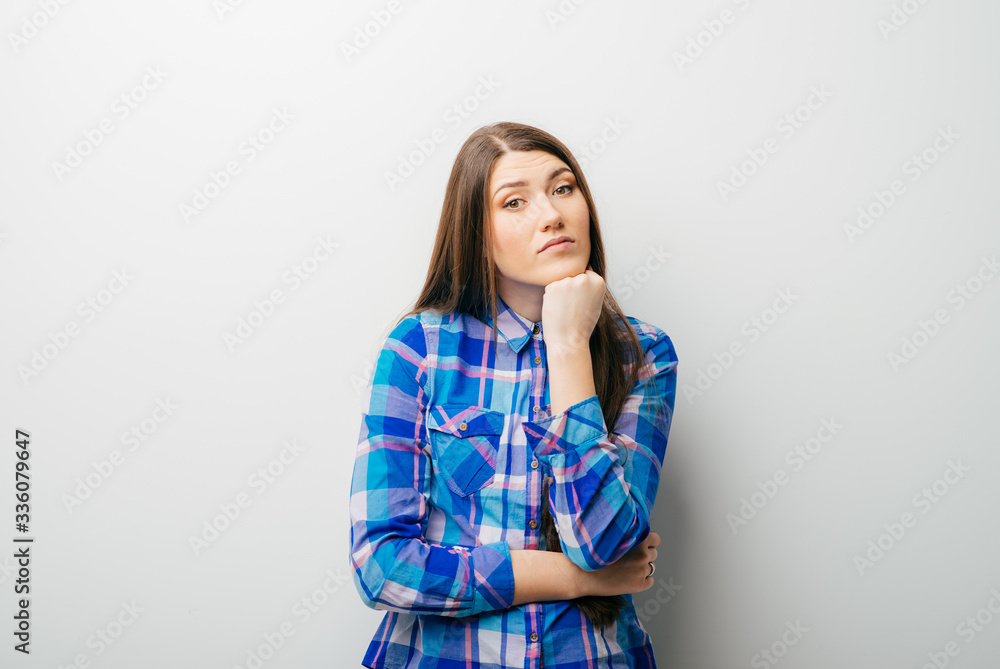 A young attractive woman holding her head A young attractive woman holding her head