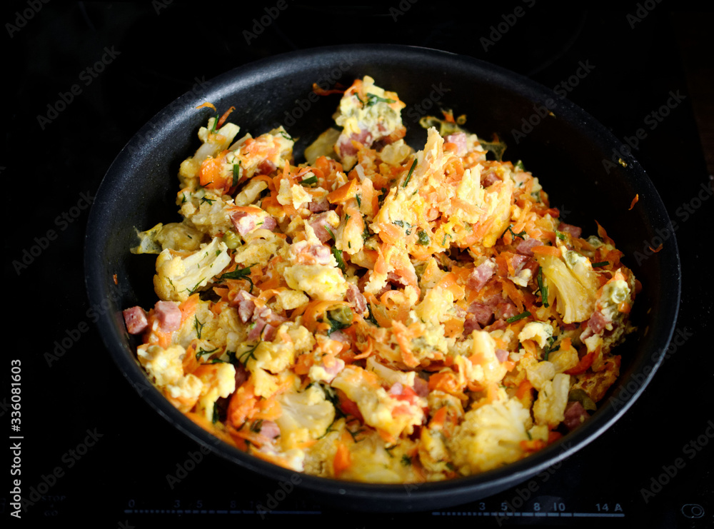 omelet with vegetables on a frying pan. omelet with vegetables on a frying pan.
