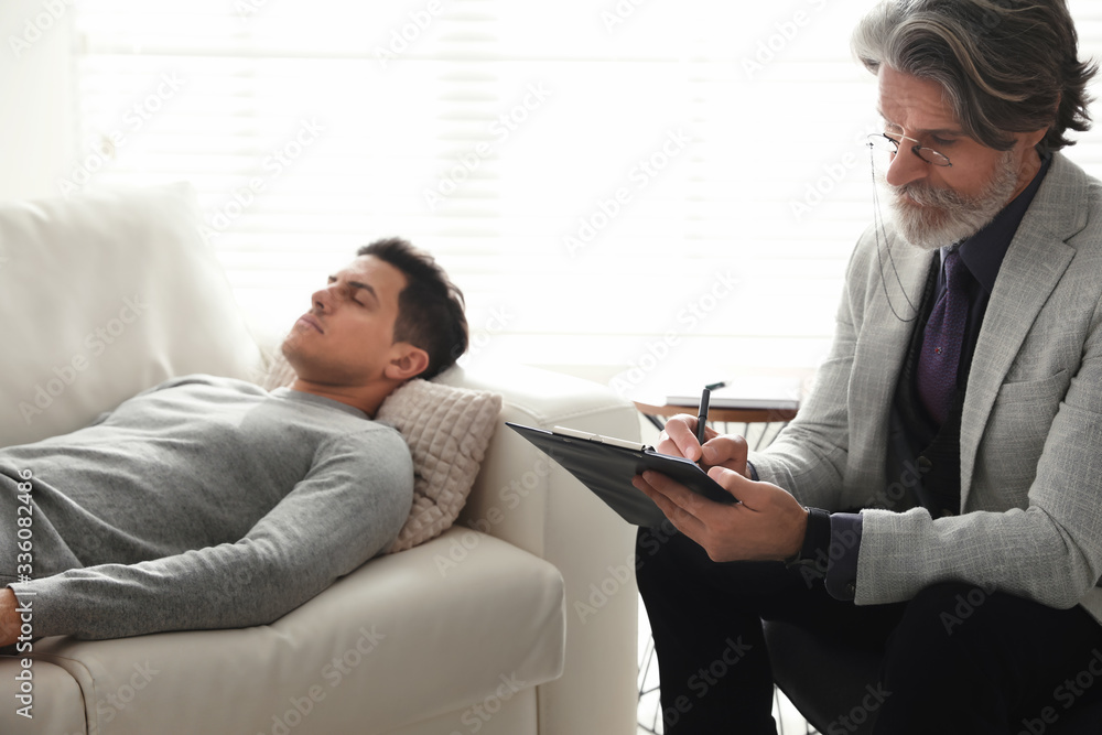 Psychotherapist and patient in office. Hypnotherapy session Psychotherapist and patient in office. Hypnotherapy session