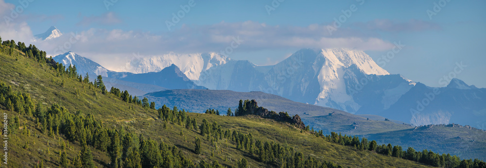 Belukha Mountain is the highest point of Altay. Panoramic view of snow-capped peaks.