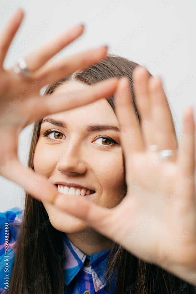 © aeroking - Playful beautiful young blond woman making a heart gesture with her fingers to show her love and affection or that she likes something © aeroking - Playful beautiful young blond woman making a heart gesture with her fingers to show her love and affection or that she likes something