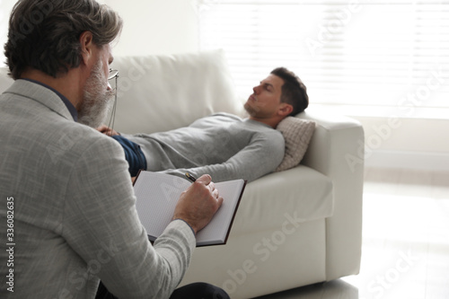 Fotografie Psychotherapist and patient in office. Hypnotherapy session