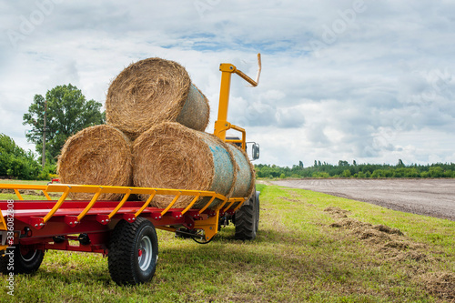 Straw on a trailer from a tractor in a field