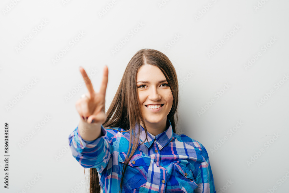 young attractive woman indicating the number two young attractive woman indicating the number two