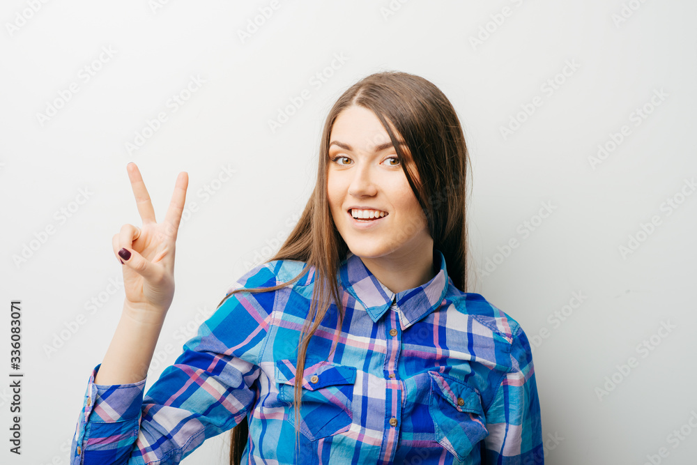 young attractive woman indicating the number two young attractive woman indicating the number two
