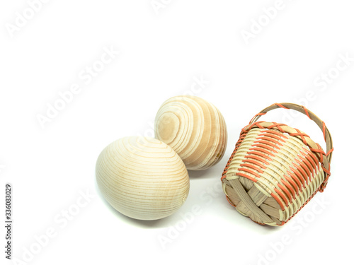 Eggs and basket isolated on a white background. Easter set. Kit of wooden eggs and basket. Basket. Easter eggs.